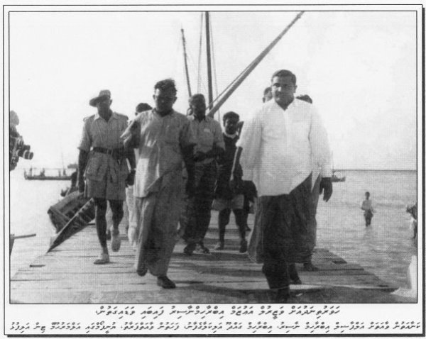 Prime Minister Ibrahim Nasir, to the right, during the genocide in Thinadhoo Island.
